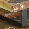 Close-up of a table leg and the edge of a tabletop made of reclaimed wood. Anteprima dell’immagine prodotto
