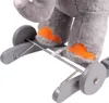 Close-up view of the lower legs and wheels of a stuffed elephant toy. Voir les images du produit