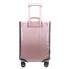 A pink suitcase with a clear protective cover, shown from the back with the handle extended. Náhľad obrázku produktu