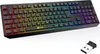 A black wireless gaming keyboard with RGB backlighting and a USB dongle. Produktbild-Vorschau