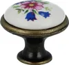 A single decorative knob with a floral design. Produktbild-Vorschau