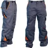 Two views of a pair of gray work pants with orange accents. Podgląd zdjęcia produktu