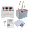 A collection of items related to a piano-themed calendar, including the calendar itself, a gift box, and cards. Produktbild-Vorschau