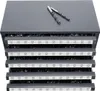 A gray metal organizer with multiple drawers filled with drill bits, with two drill bits on top. Podgląd zdjęcia produktu