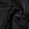 A close-up view of a black quilted fabric, likely a blanket or duvet. Anteprima dell’immagine prodotto