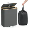 A laundry hamper with a lid and a separate trash bag. Produktbild-Vorschau