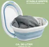 A collapsible laundry basket filled with clothes, shown with a second basket in the background. Produktbild-Vorschau