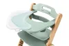 A close-up view of a green high chair with a wooden frame and a detachable tray. Náhľad obrázku produktu