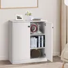 A white cabinet with its doors open, displaying shelves with books and decorative items. Podgląd zdjęcia produktu