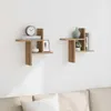 Two wooden wall shelves mounted on a white wall above a sofa. Anteprima dell’immagine prodotto
