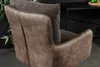 Close-up view of the back and side of a brown armchair with a textured gray cushion. Produktbild-Vorschau