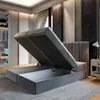 A bedroom with a bed frame that has its storage compartment open. Produktbild-Vorschau