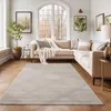 A living room scene with a sectional sofa and a rug.