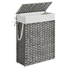 A gray woven laundry basket with a white liner and a lid. Produktbild-Vorschau