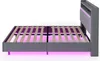 A side view of a gray upholstered bed frame with a slatted wooden mattress support and purple LED lighting underneath. Produktbild-Vorschau