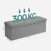 A grey storage ottoman with dimensions and weight capacity indicated. Náhled obrázku produktu
