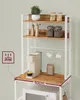 A kitchen baker's rack with various items, including a coffee maker, coffee cups, jars, and a microwave. Náhled obrázku produktu