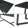 Collage of close-up shots of a black marble-top table with gold veining and metal legs. Voir les images du produit