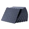 A stack of interlocking garage floor tiles. Voir les images du produit