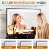 A woman is applying makeup in front of a lighted mirror, with three color temperature options displayed below. Produktbild-Vorschau