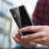 A person holding a clear phone case with a Samsung phone inside. Anteprima dell’immagine prodotto