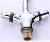 A close-up shot of a chrome faucet with temperature controls. Náhled obrázku produktu