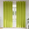 Two green curtains hanging in front of a window. Náhľad obrázku produktu
