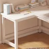 A white corner desk with books and a small figurine on top. Produktbild-Vorschau