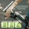 A person's hand is shown gripping the handlebars of a bicycle, with text overlays highlighting features. Produktbild-Vorschau