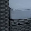 A close-up view of a black rattan sofa with a gray cushion. Produktbild-Vorschau