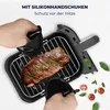 Hands using silicone mitts to handle a cooked steak on a grill rack. Anteprima dell’immagine prodotto