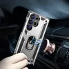 A hand holding a silver phone case with a ring stand, magnetically attached to a rose gold car mount on a car's air vent. Produktbild-Vorschau