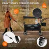 A woman is pulling a wagon with a baby in it, outdoors. Náhled obrázku produktu