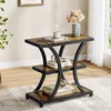 A side table with decorative items in a living room setting. Produktbild-Vorschau