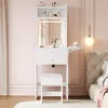 A white vanity table with a lighted mirror and stool is set up in a bedroom with pink walls. Anteprima dell’immagine prodotto