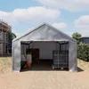 A large gray tent structure used as a temporary shelter or storage on a construction site. Voir les images du produit