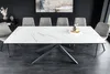 A modern dining room with a white ceramic marble-patterned extendable dining table and gray upholstered chairs. Produktbild-Vorschau