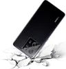 A black smartphone with a camera module is shown at an angle, appearing to fall onto a cracked white surface. Produktbild-Vorschau