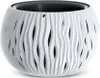 A white planter with a wavy, cut-out design and a black inner pot, shown against a white background. Náhled obrázku produktu