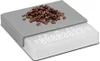 A digital scale with coffee beans on top. Produktbild-Vorschau