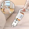 A person is using a handheld vacuum cleaner on a sofa. A circular inset shows the vacuum cleaner being used on a wooden floor. Produktbild-Vorschau