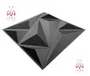 A 3D geometric wall panel is displayed against a white background, with logos in the top-left and bottom-right corners. Produktbild-Vorschau