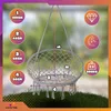 A hanging chair with measurement indicators and feature icons. Voir les images du produit