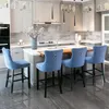 A modern kitchen with a central island and bar stools. Produktbild-Vorschau
