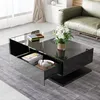 A modern living room scene featuring a black coffee table with a glass top, a green sofa, and a rug. Podgląd zdjęcia produktu