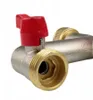 Close-up of a plumbing valve with a red handle. Produktbild-Vorschau
