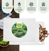 A flat lay image showing a packet of rosemary seeds, surrounded by soil, gardening gloves, and a small plant in a pot. Produktbild-Vorschau