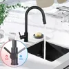 A black kitchen faucet is shown in a modern kitchen sink with water running. Anteprima dell’immagine prodotto