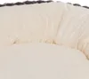 A close-up view of a soft, plush dog bed with a cream-colored interior and a gray textured border. Produktbild-Vorschau