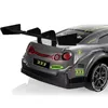 Close-up rear view of a gray remote-controlled toy car with a large spoiler. Produktbild-Vorschau